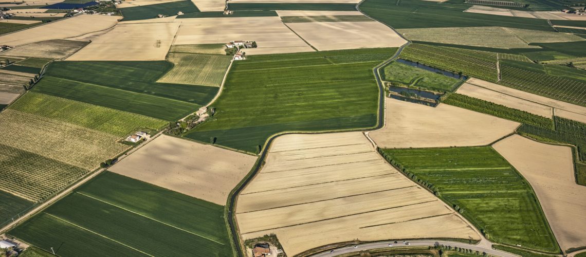 Breathtaking aerial view showcasing the vibrant, green landscapes of Italy's fertile Po Valley countryside